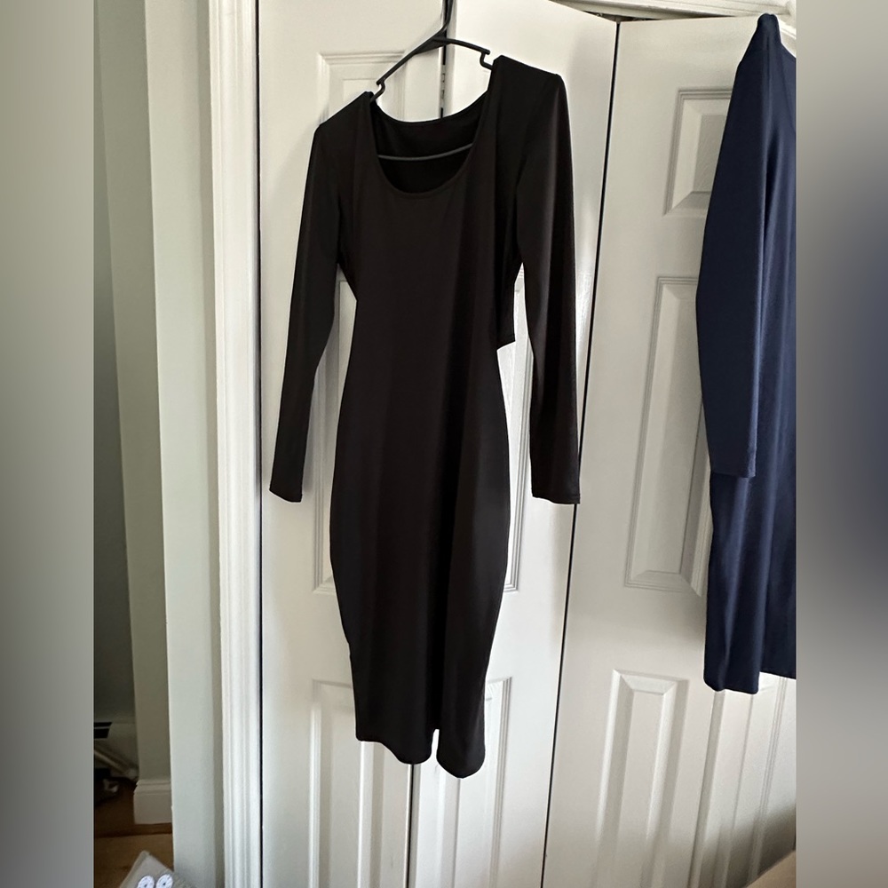 Black long sleeve cut out back fitted midis dress. Size medium